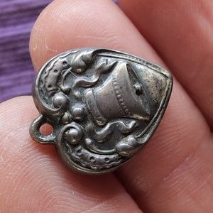 Antique sterling silver puffed heart charm